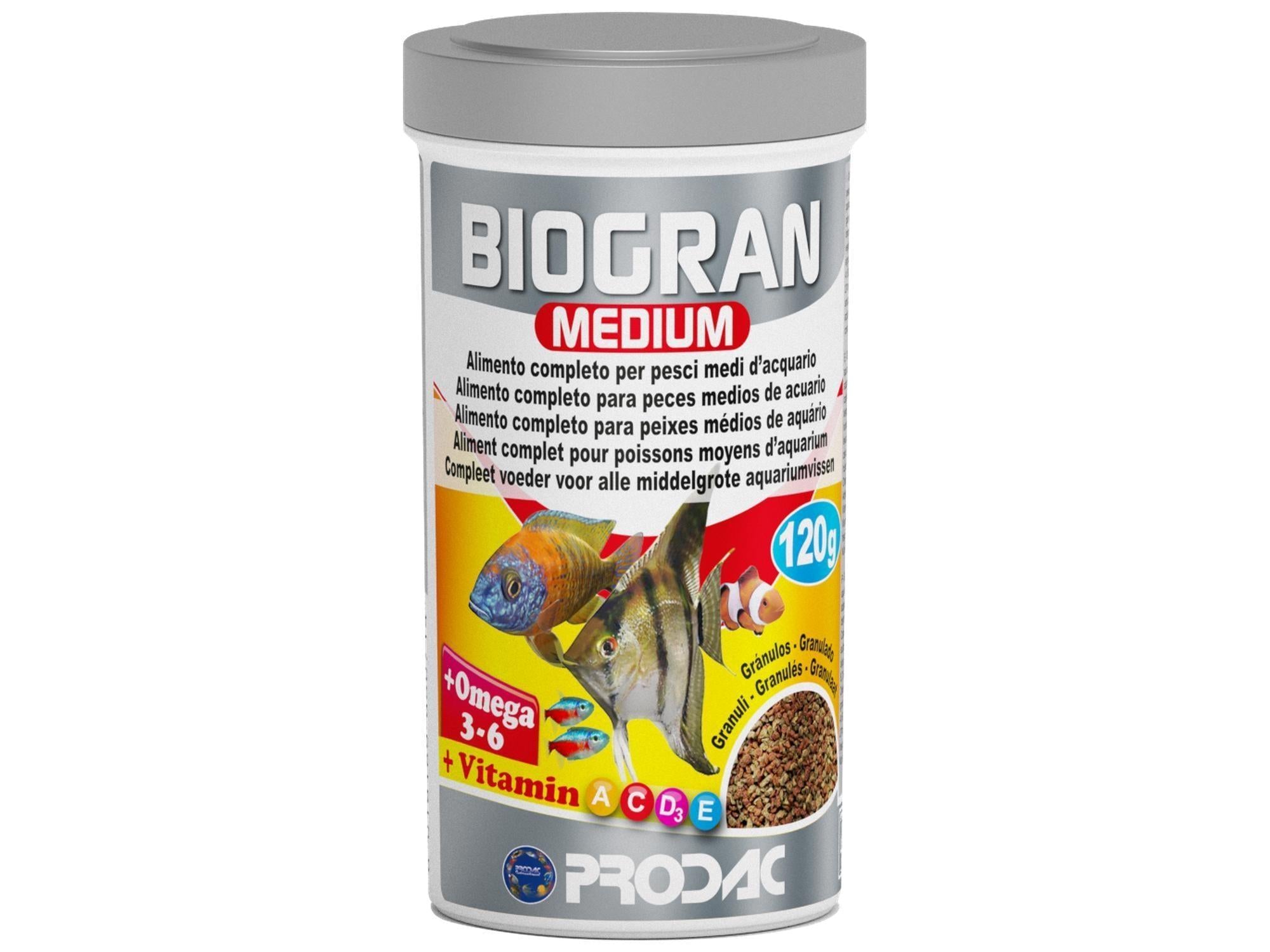 Biogran Medium fiskefôr i hvit beholder med grått lokk, viser akvariefisk og granulat.