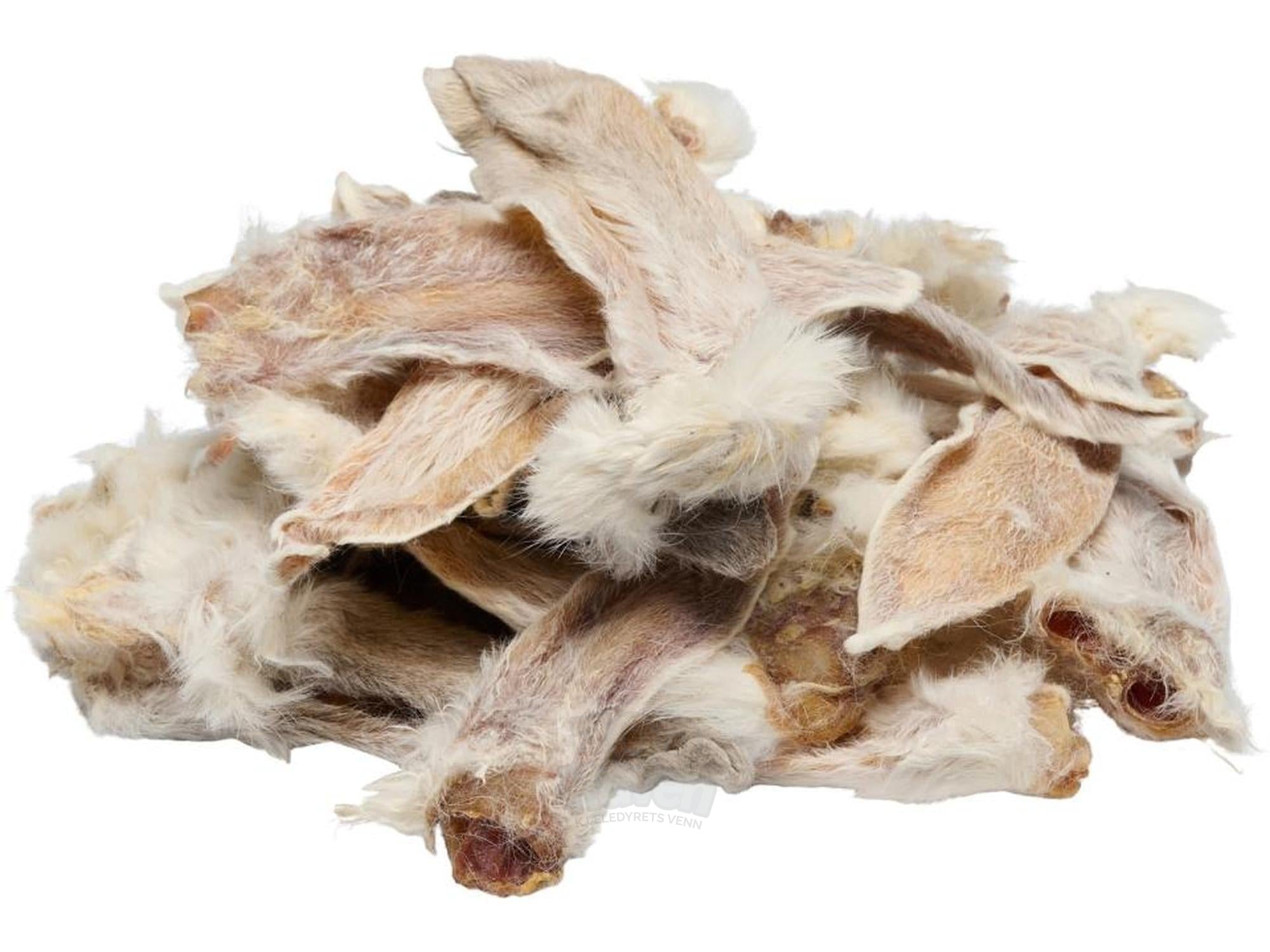 Trixie kaninører med pels, naturlige tørkede tyggeben i lysebrune og hvite nyanser.