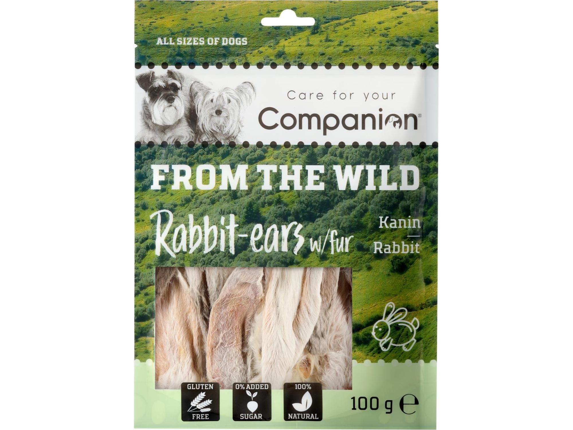 Companion From the Wild kaninører med pels, 100g, i en grønn og hvit pose med hundebilder.