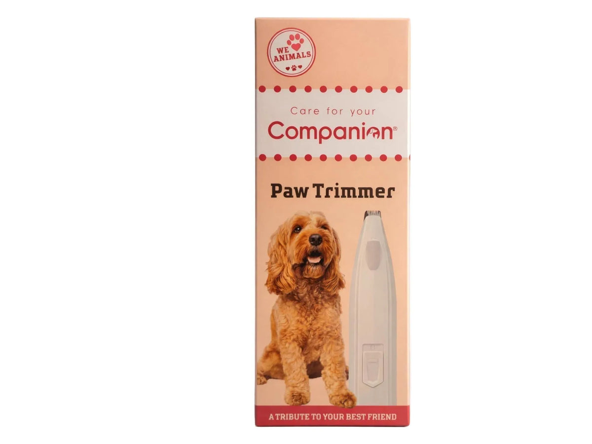 Companion Potetrimmer med LED-lys, hvit og beige, på en oransje og hvit eske med en hund.