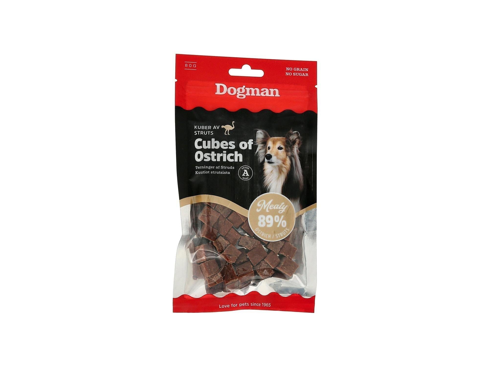 Dogman Kuber av Struts hundegodbiter 80g i en svart og rød pose med et bilde av en hund.