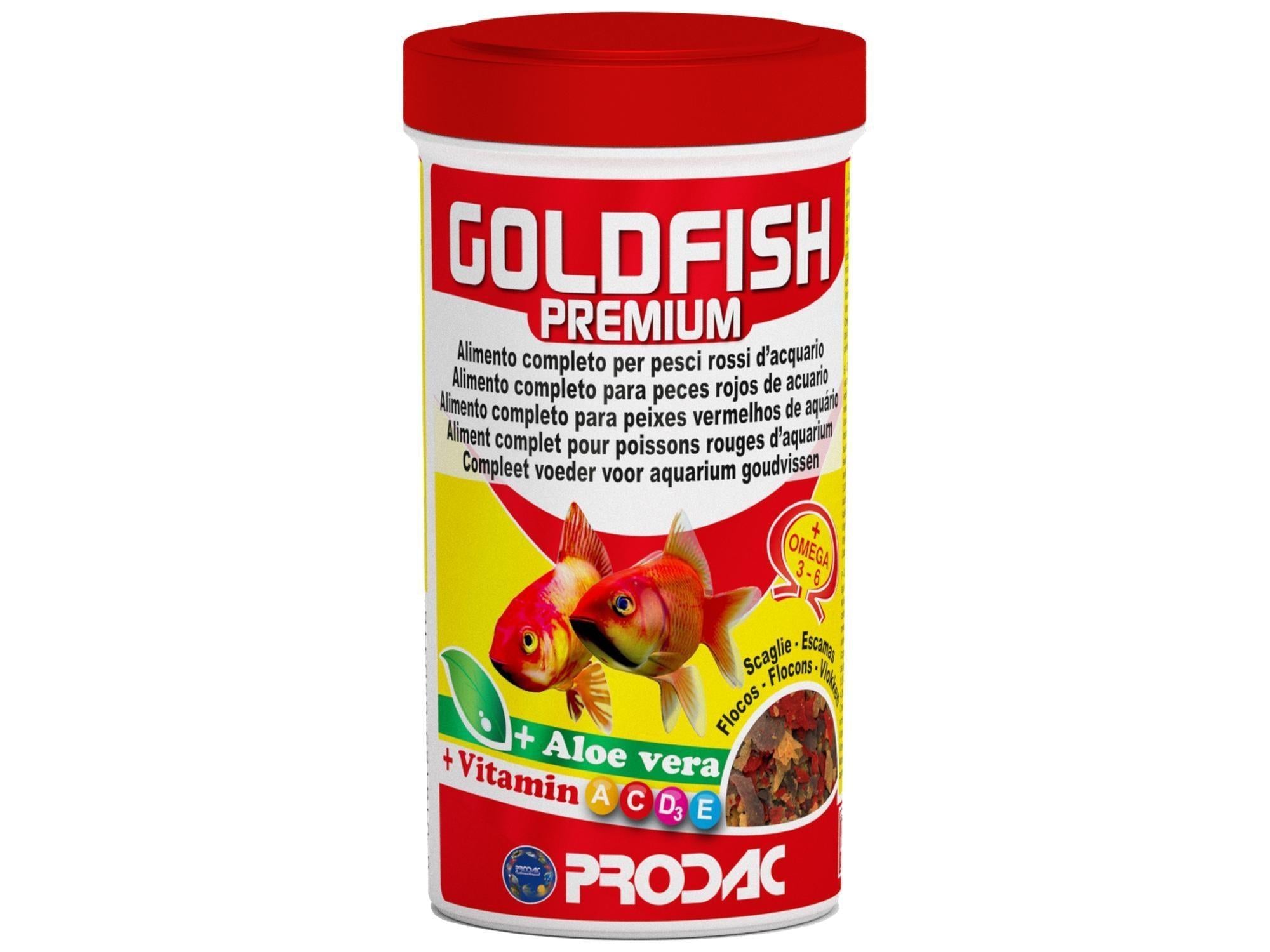 Goldfish Premium flakes 20gr fish food in a white container with red lid, featuring two goldfish and "Aloe vera + Vitamin A C D E" text.