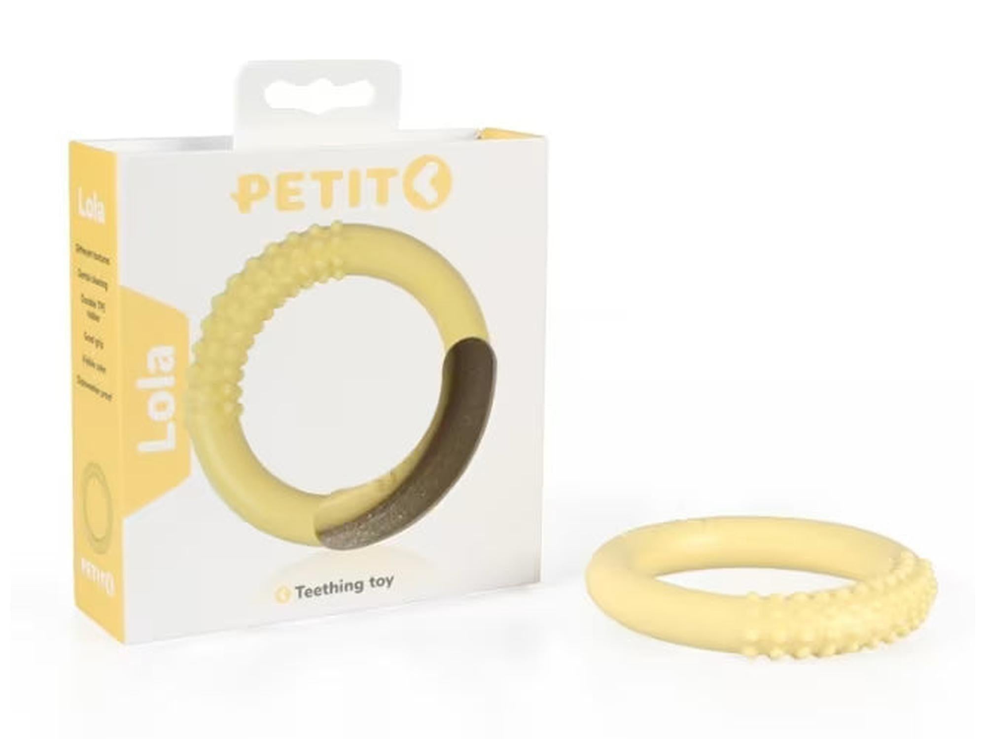 Gul Petit Lola tannleke for valper, ringformet TPE-gummi med teksturert overflate, ved siden av esken.