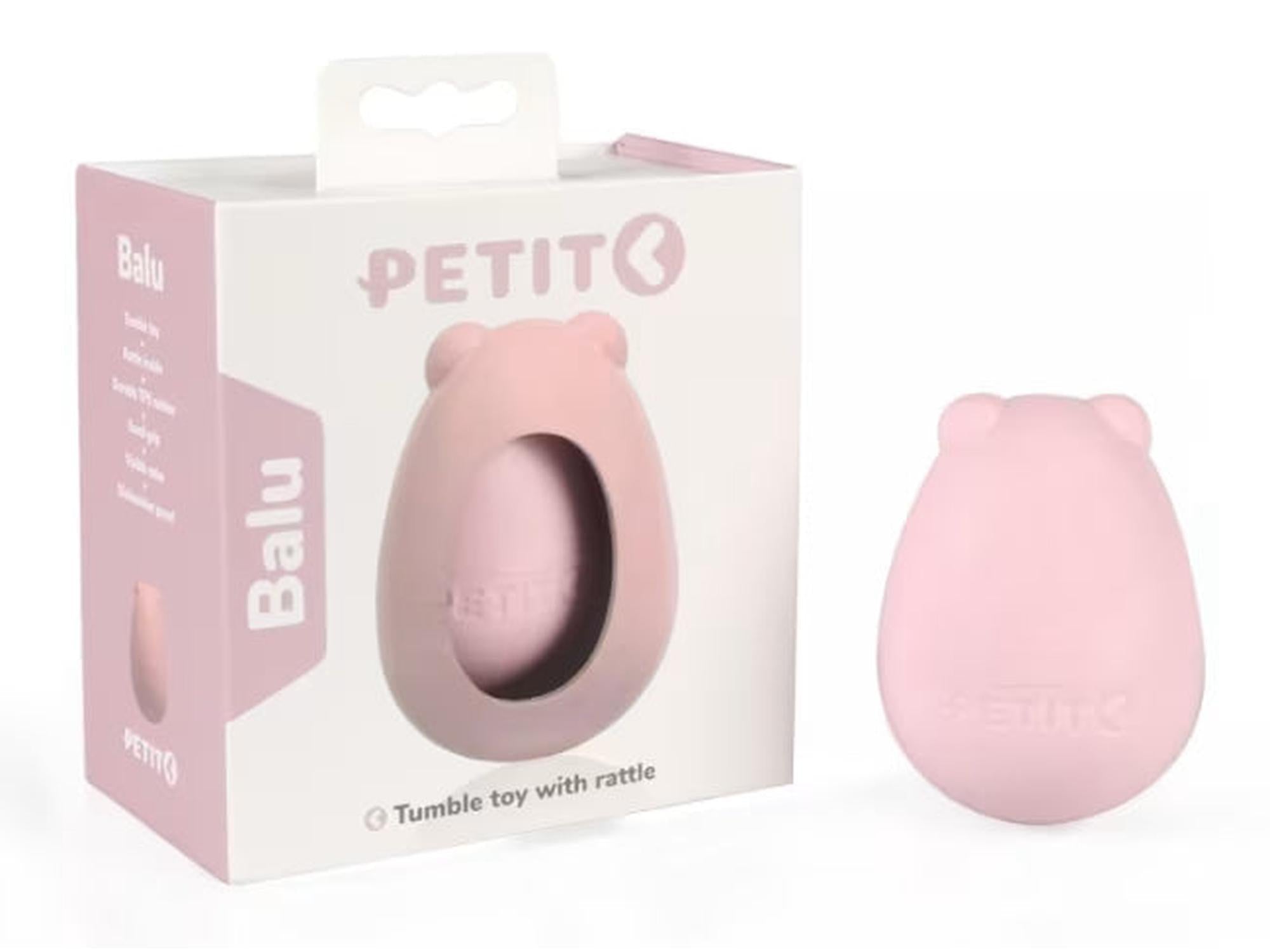 Rosa Petit Tumble Balu valpeleke i TPE-gummi, bjørneformet med selvoppstående design, ved siden av esken.