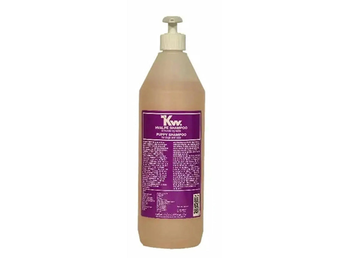 KW Protein Hvalpeshampo 1000ml flaske med pumpe, lys oransje væske og lilla etikett.