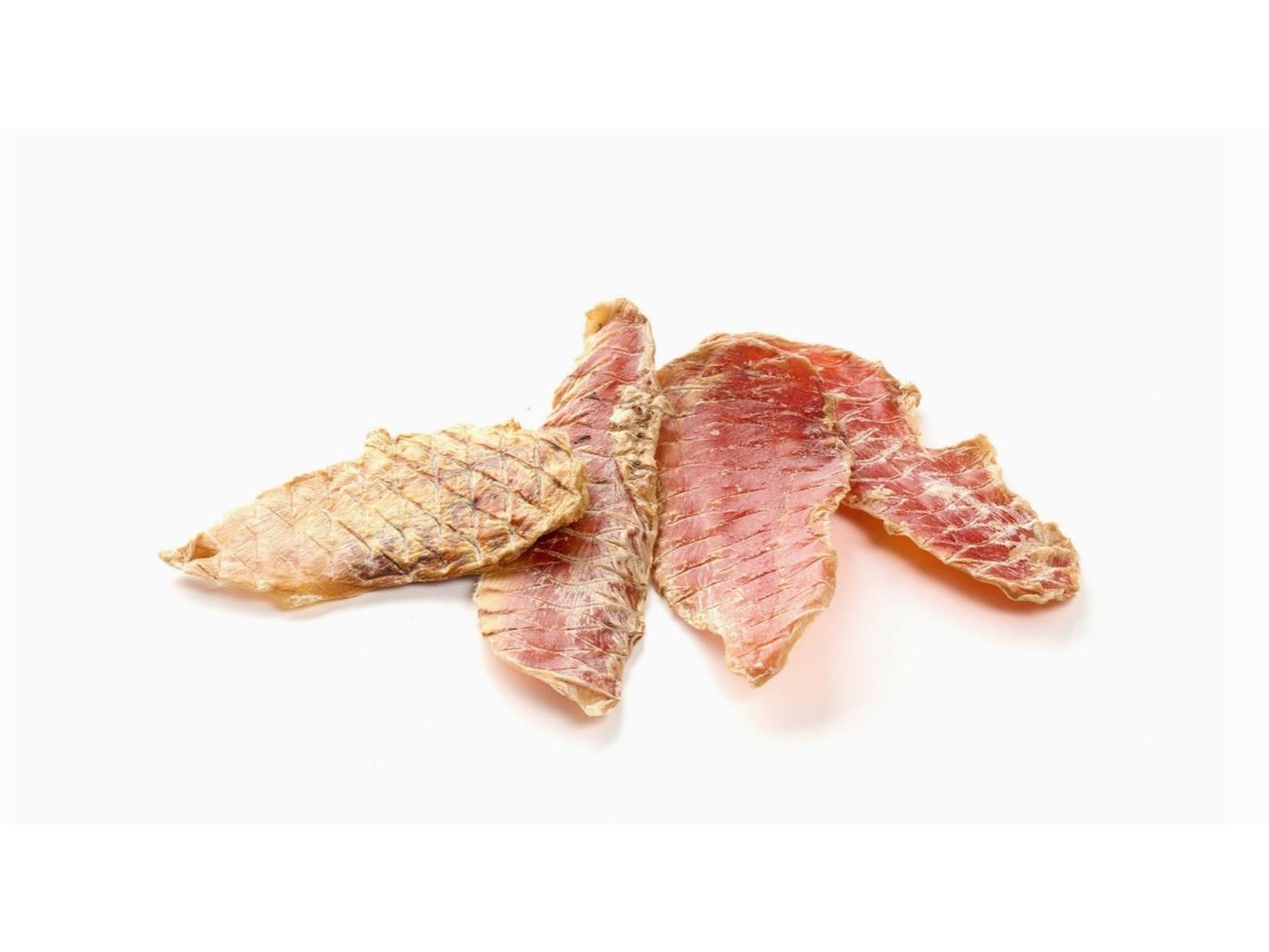 Gullbrune kalkunfilet-biter i en gjennomsiktig pose med Zootreat-etikett, holdt lukket av en svart klemme.