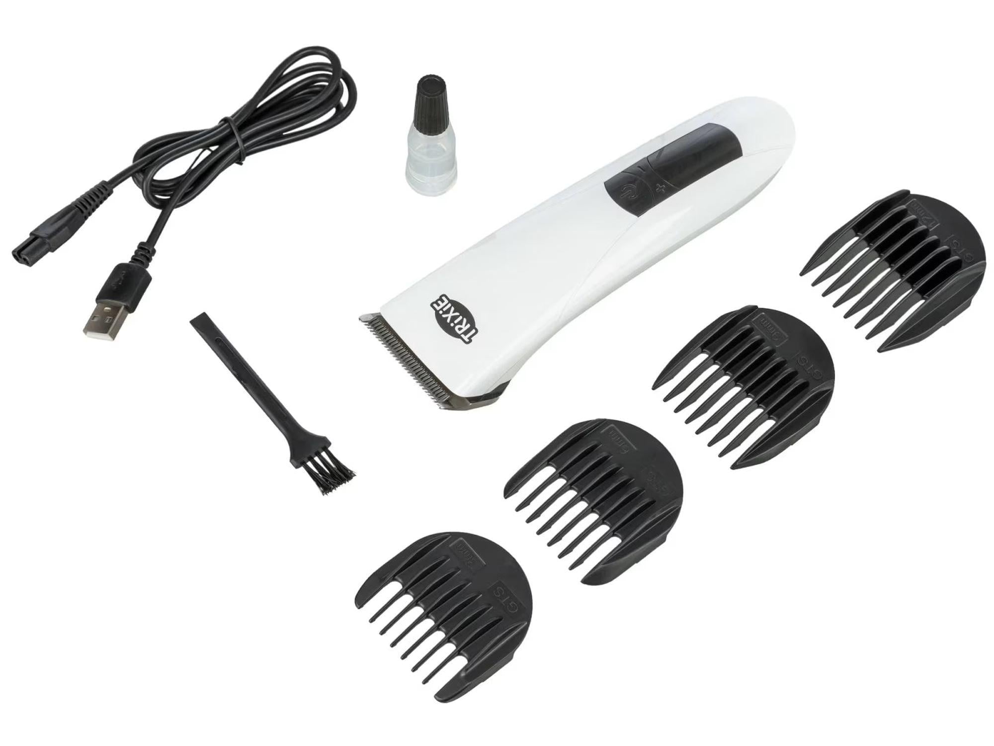 Hvit/sort trådløs Klippemaskin TR1600 med fire sorte avstandskammer, ladekabel, olje og børste.