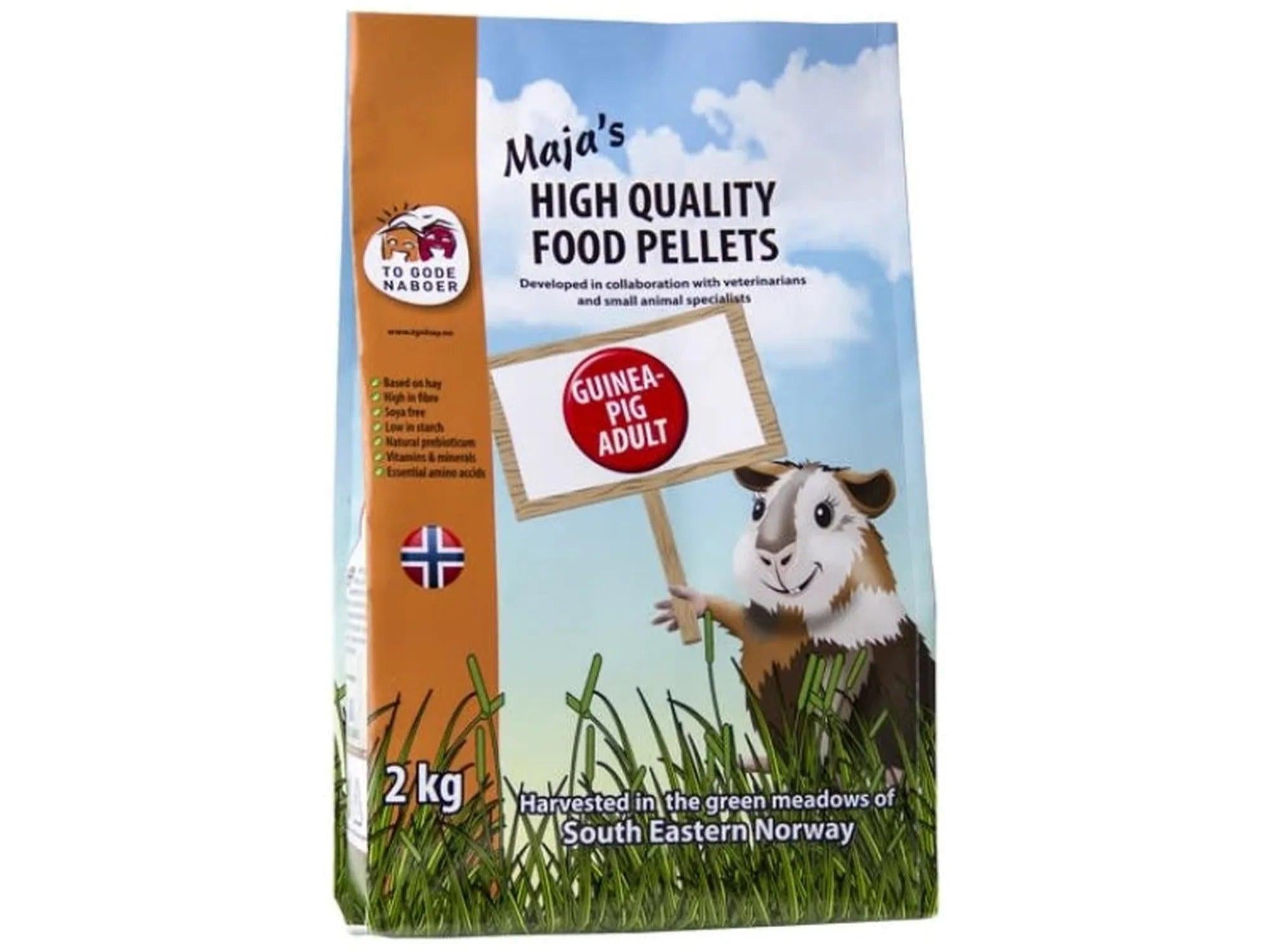 Maja's Marsvin Adult 2kg guinea pig food bag with a cartoon guinea pig holding a sign.