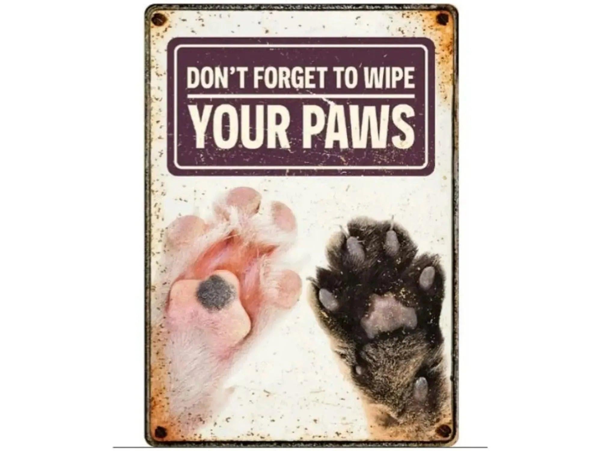 Metallskilt 21x14,8cm med "Don't Forget to Wipe Your Paws" tekst og bilde av to kattepoter.