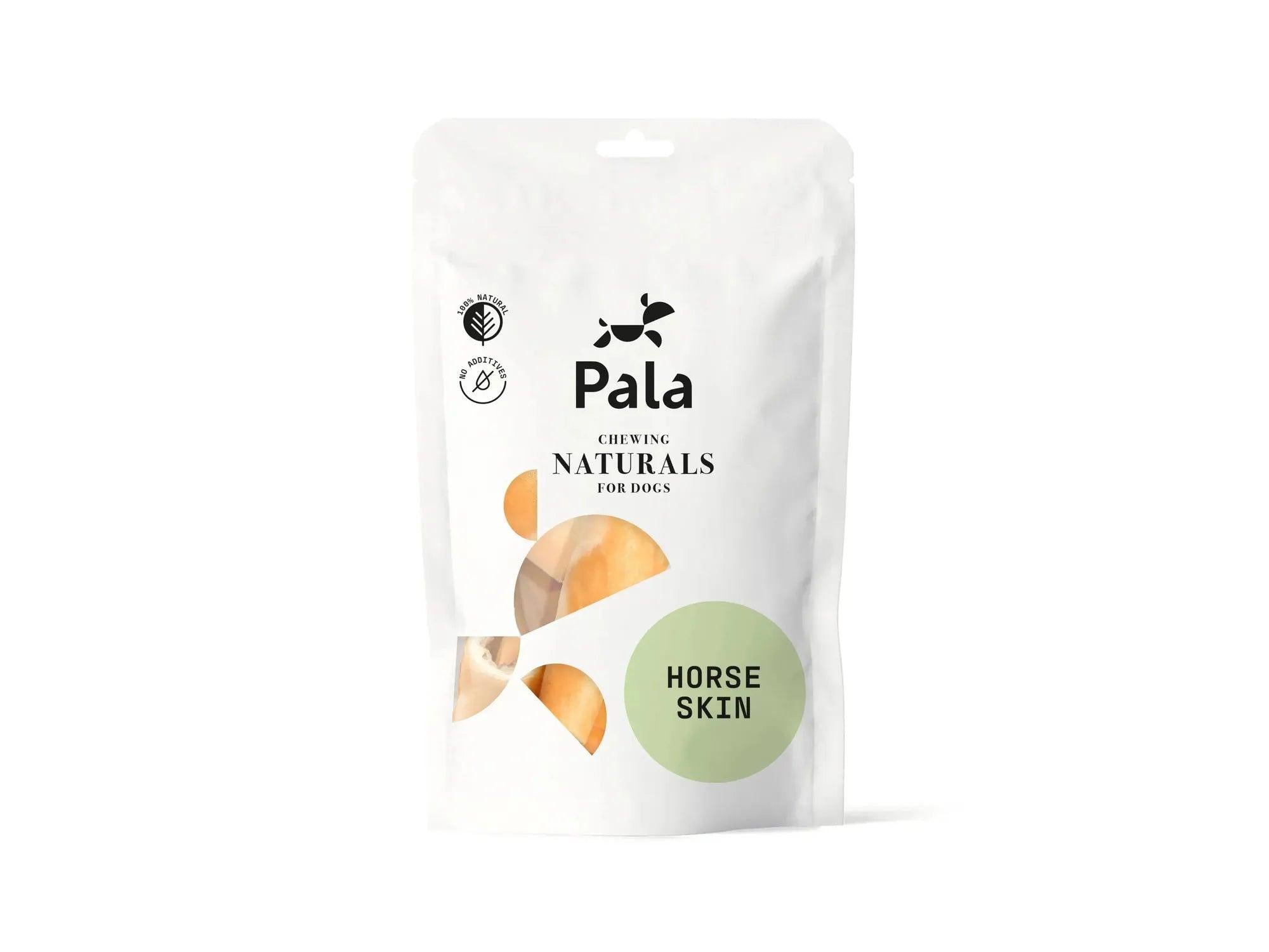Hvit pose med Pala Horse Skin naturlig hundetygg av hestehud, med grønn sirkel og oransje detaljer.