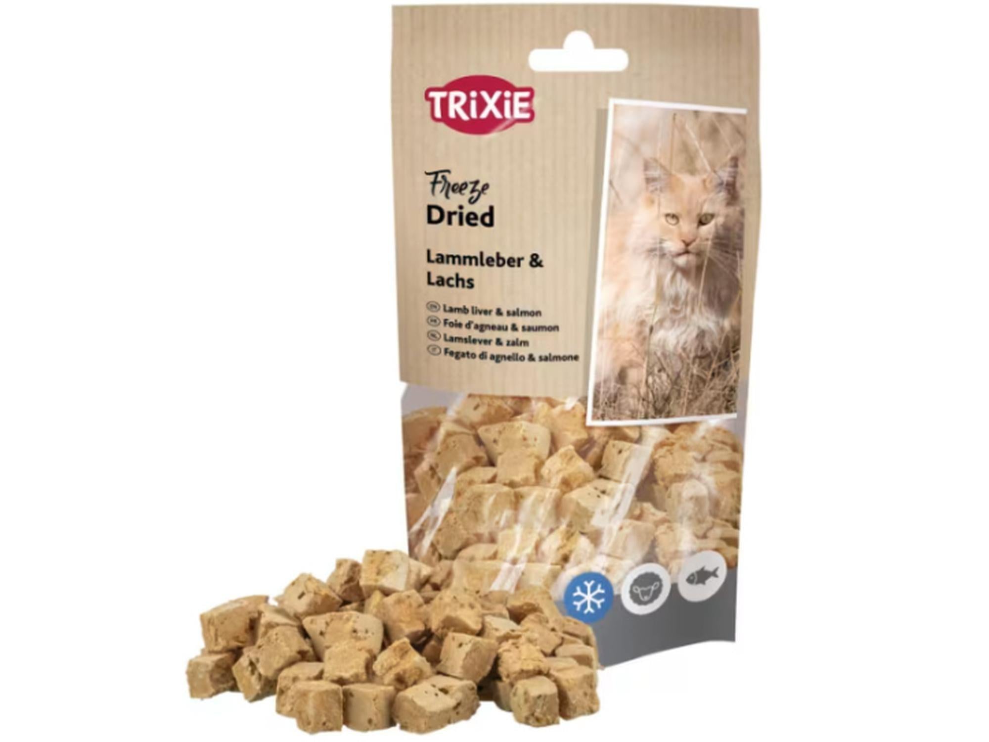 Trixie Freeze Dried Lamb Liver & Salmon cat treats in a brown and clear pouch with a cat photo, surrounded by scattered light brown cubes.