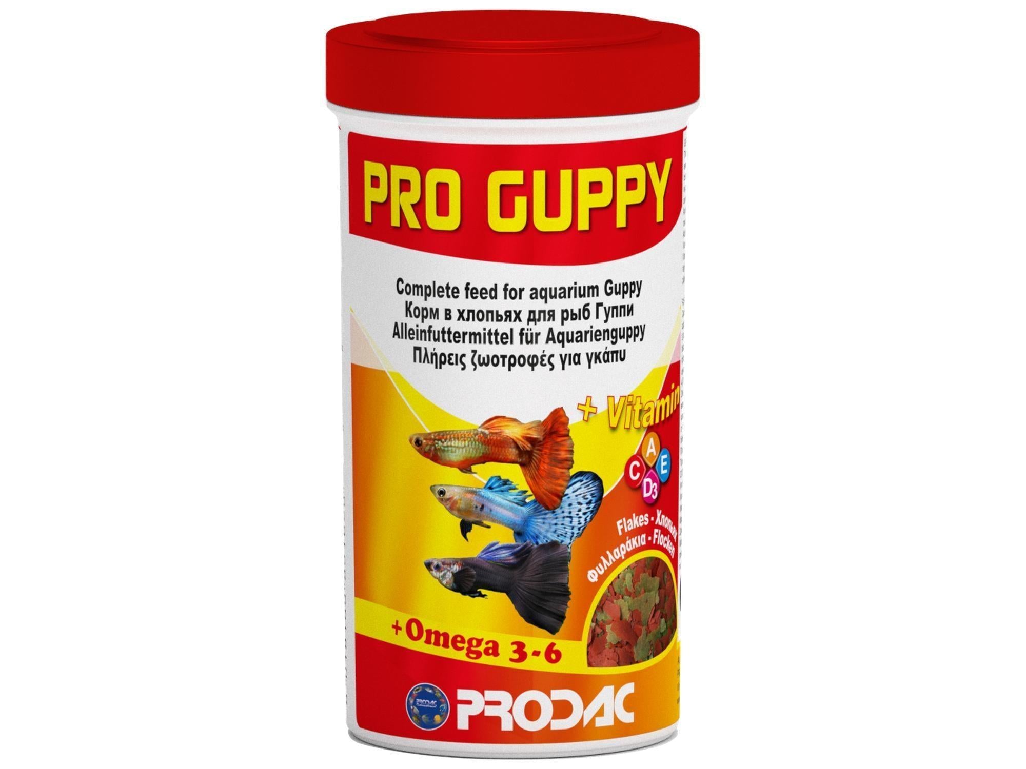 Prodac Pro Guppy Flakes fiskefôr i en hvit beholder med rød topp og guppy-illustrasjoner.