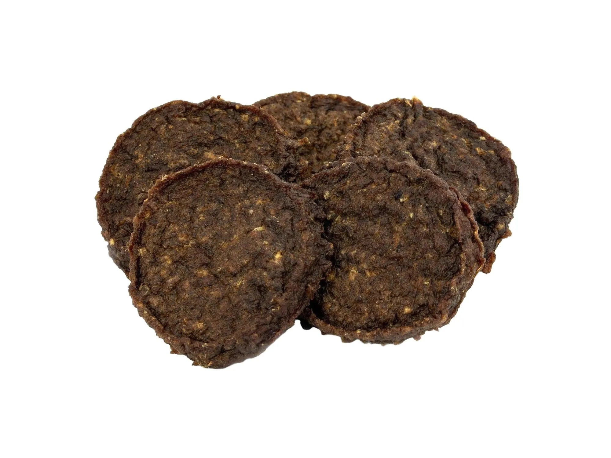 Fem mørkebrune, runde SANA Horse Burgers med gresskar og pære hundegodbiter.