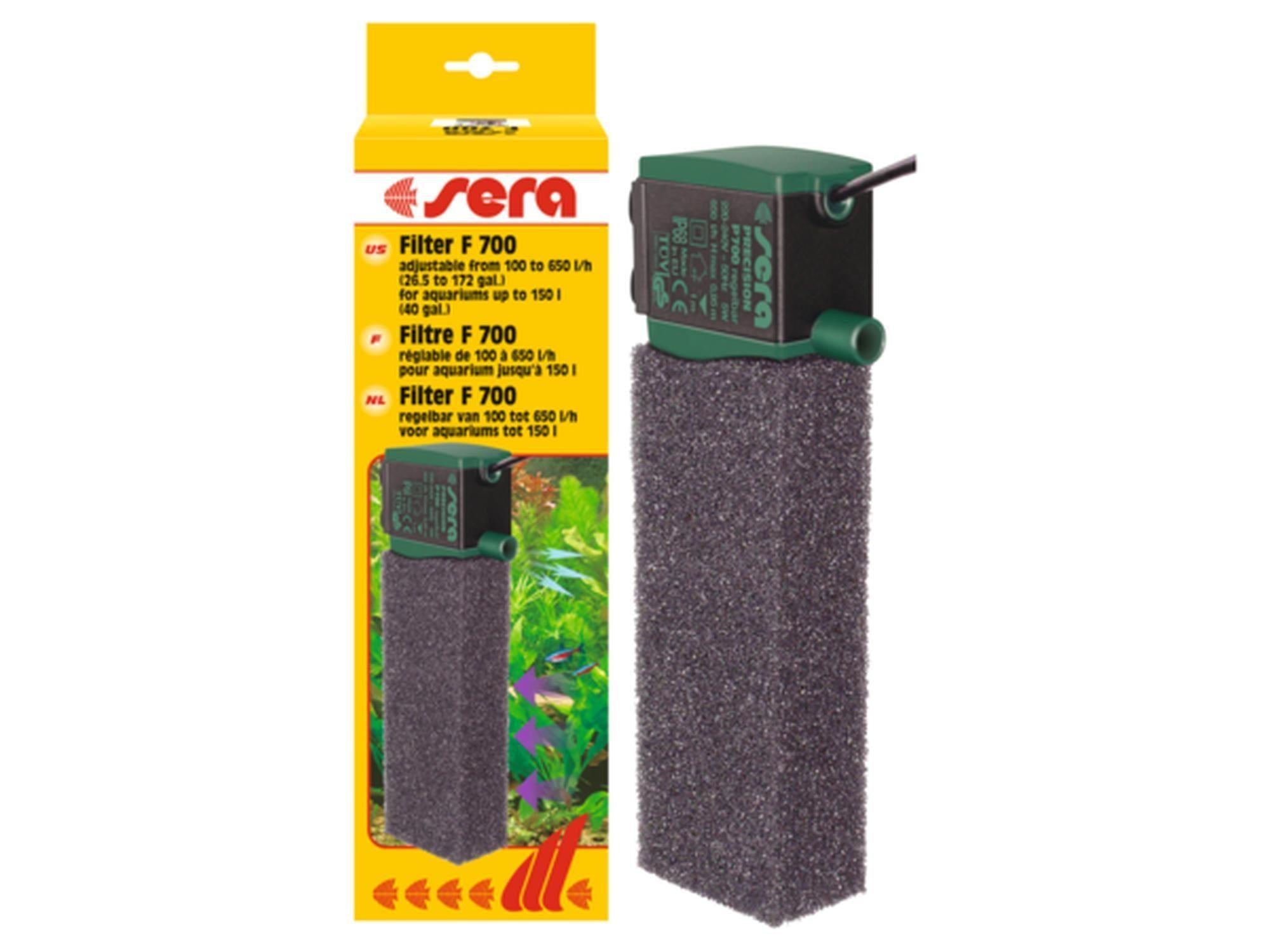 Sera Filter F 700 akvariefilter med mørkegrønn topp og svart svamp, ved siden av gul emballasje.
