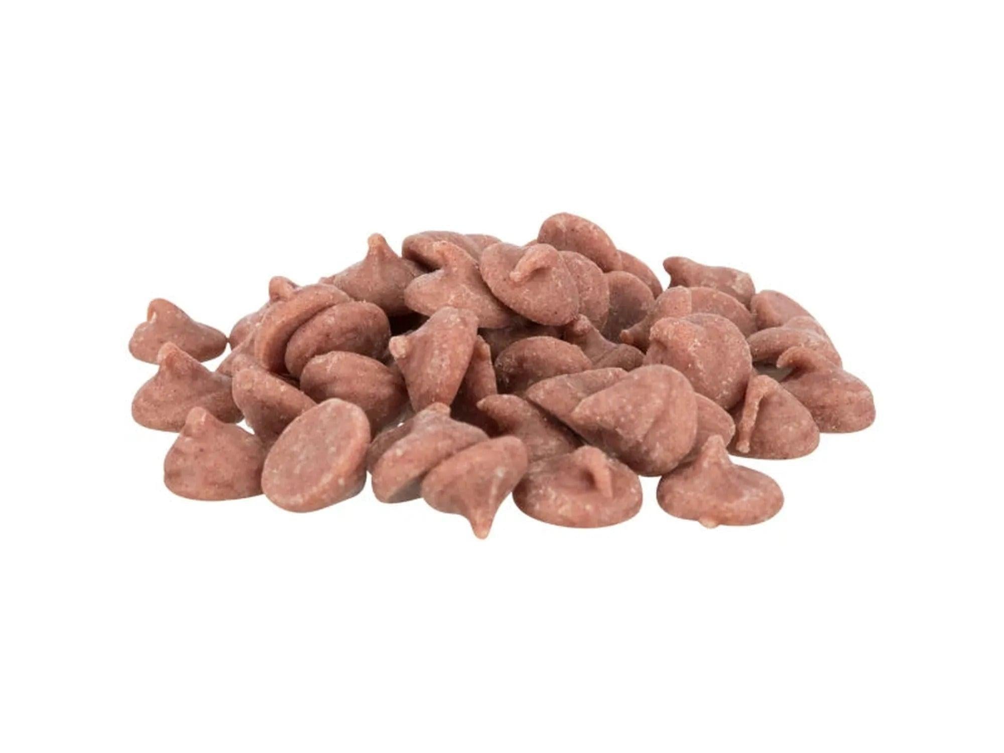 En haug med rosa, skogsbærsmakende gnagerdrops med vitaminer og mineraler.