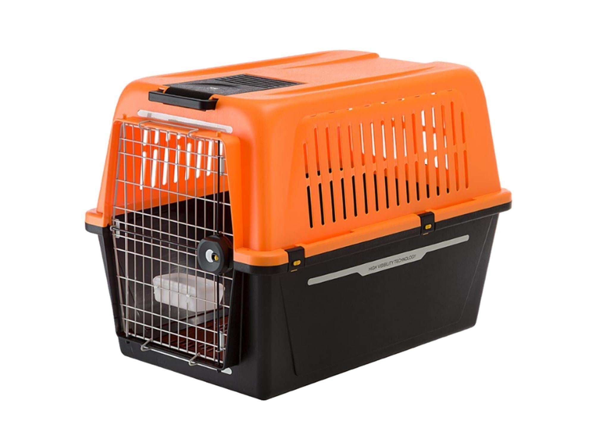 Oransje og svart Atlas 60 hundetransportkasse i plast med metallgitterdør og ventilasjon.