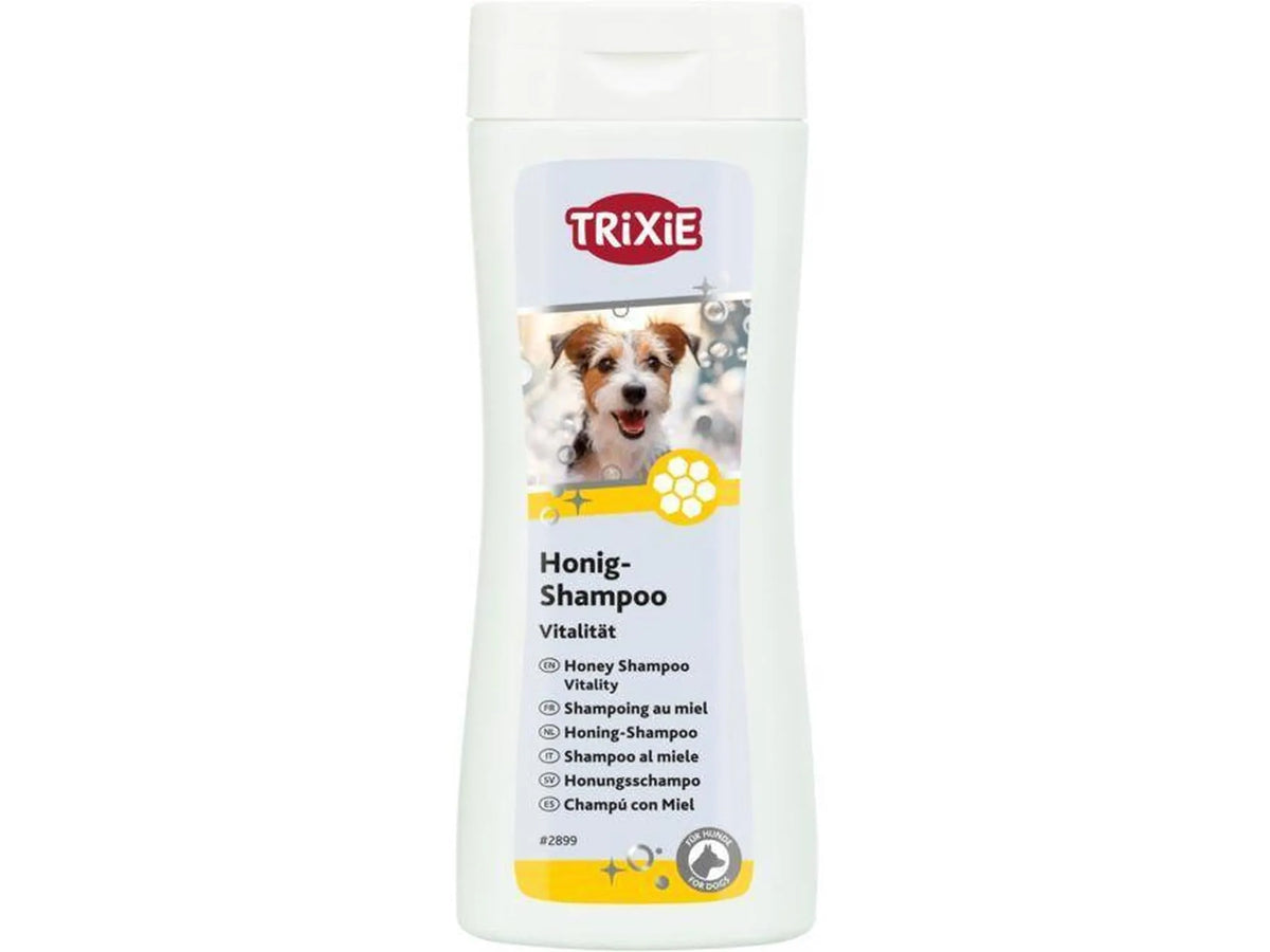 Hvit Trixie Honning-Shampoo flaske med bilde av en hund og honningkake-design.