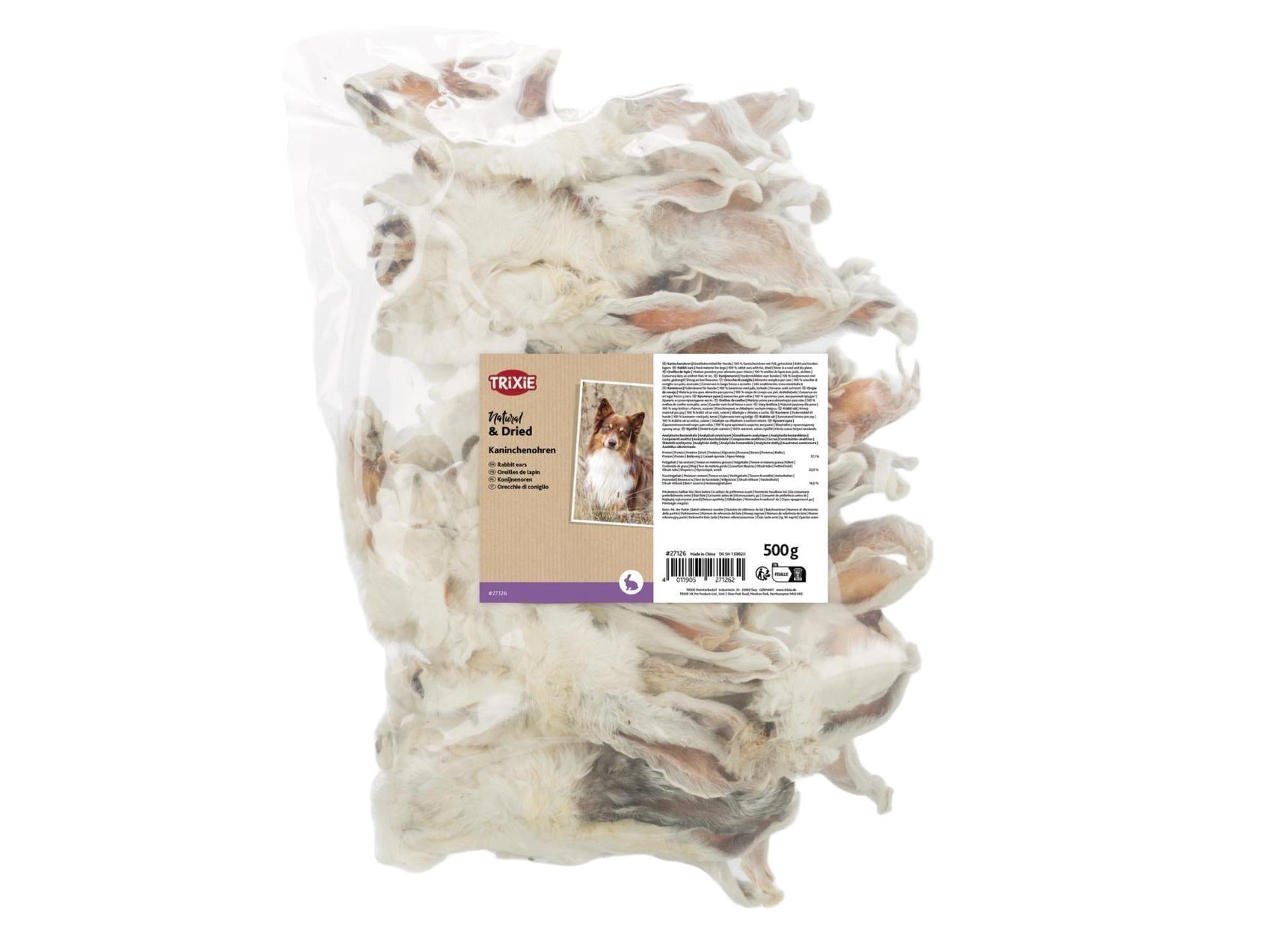 Trixie Kaninører med pels, 500g pose med naturlige, tørkede tyggeben i lysebrune og hvite nyanser.