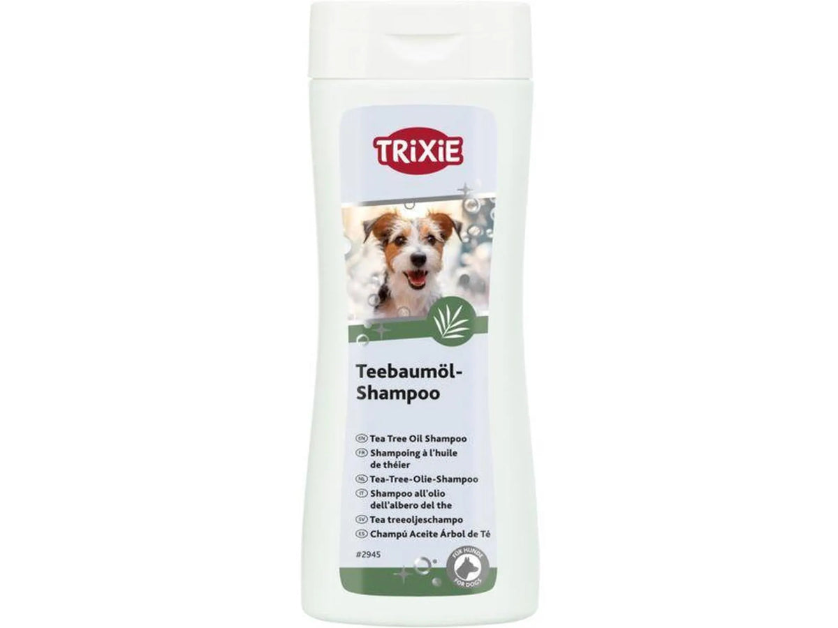 Hvit Trixie Tea Tree Oil Shampoo 250 ml flaske med bilde av en hund og grønne detaljer.