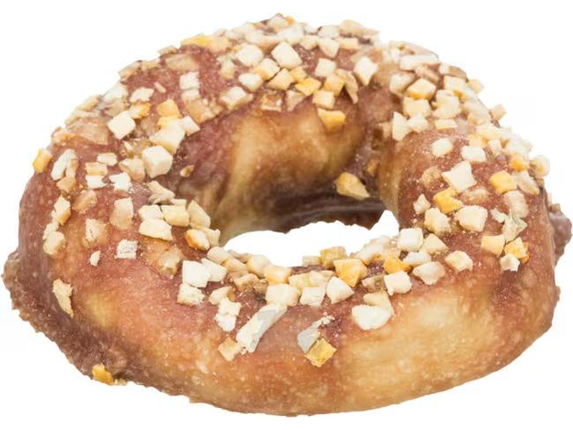 Brun råhud tyggering for hund, donut-formet med lyse biter av frukt/grønnsaker på toppen.