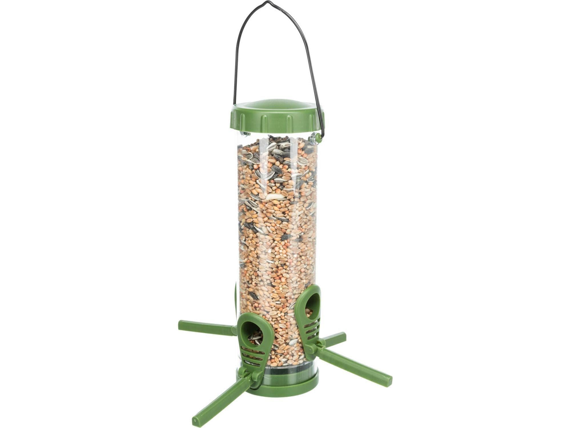 Grønn og transparent fugleautomat i plast, 23 cm høy søyledesign med fuglefrø og sittepinner.