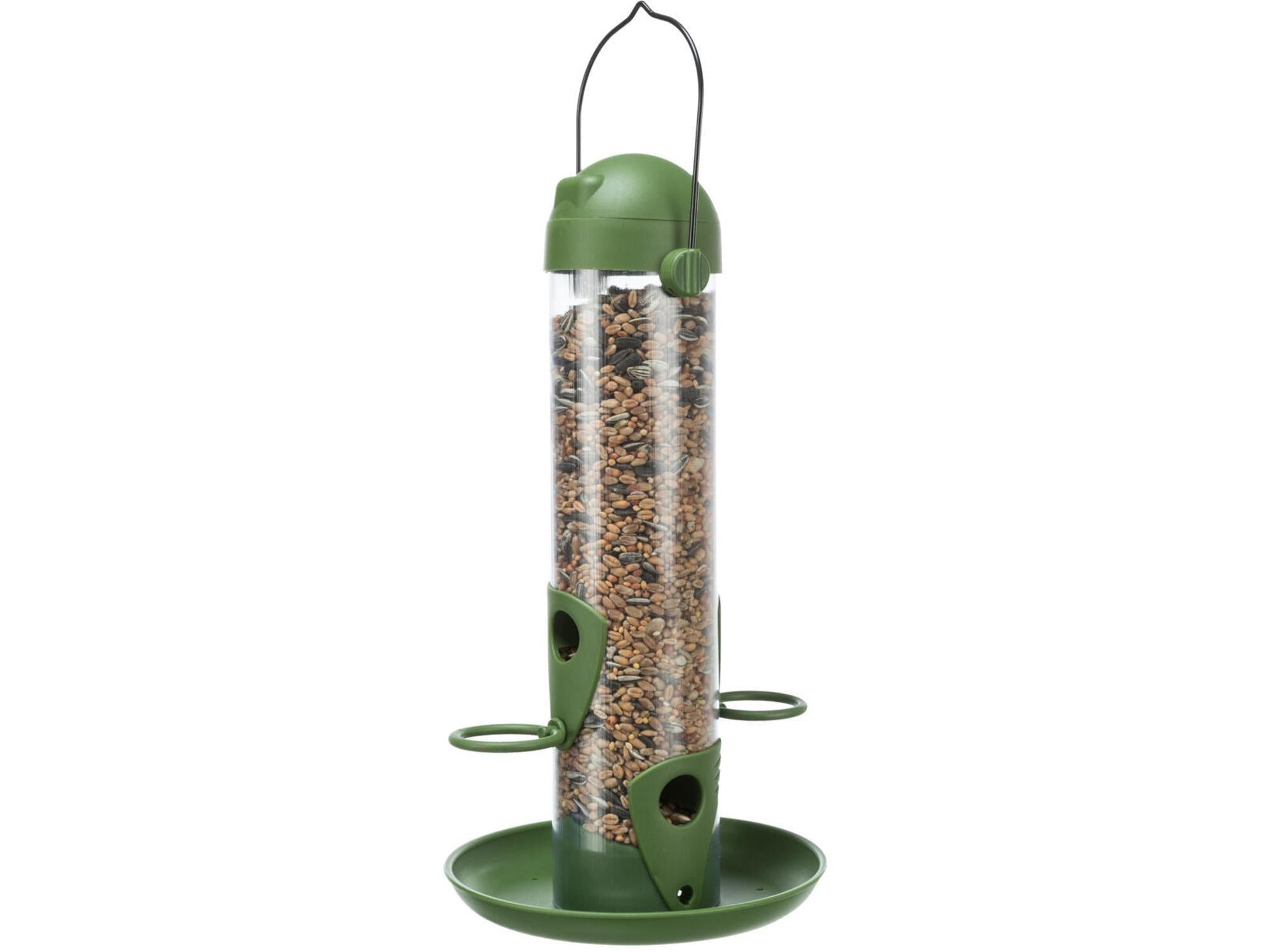 Grønn og transparent søyleformet fuglemater i plast, 750 ml, fylt med fuglefrø.