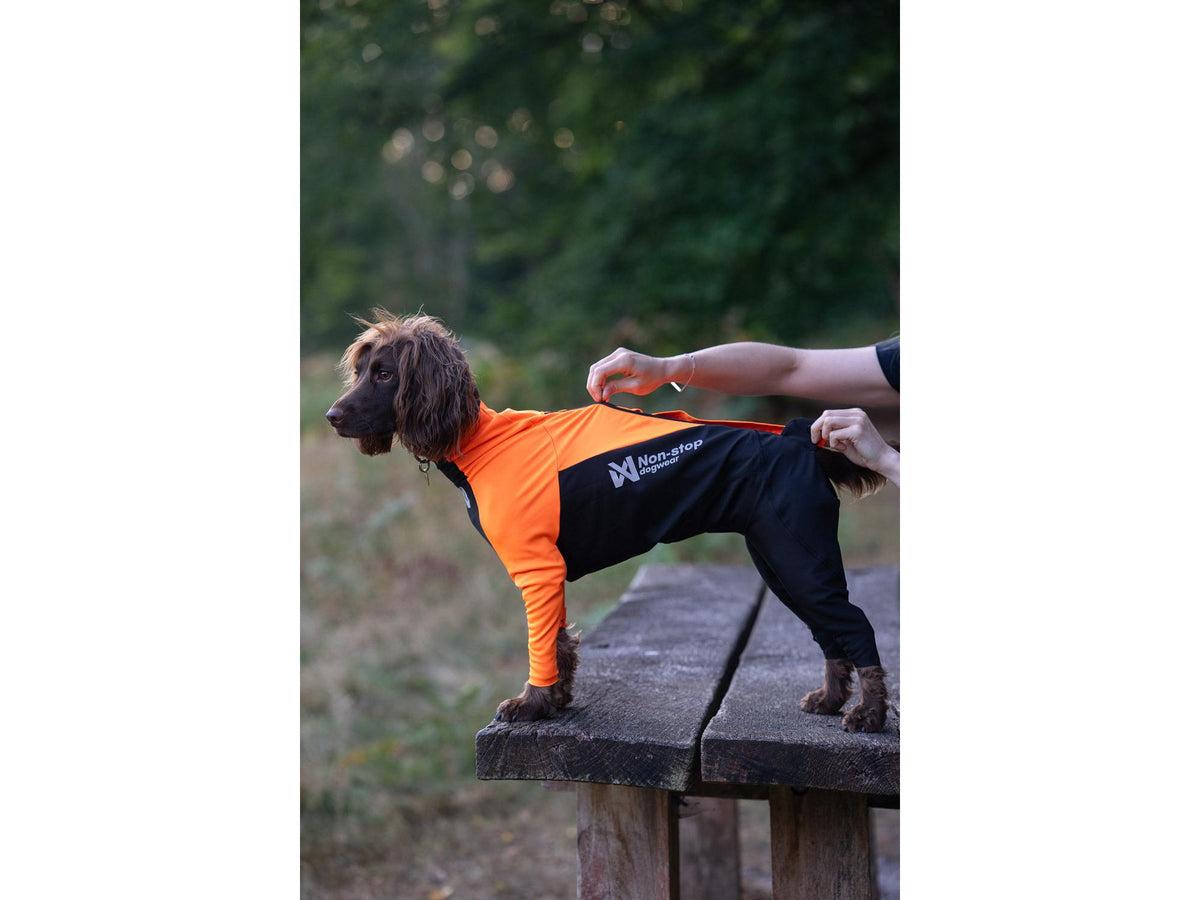 Non-stop dogwear Protector suit heldress tispe – Oransje/svart